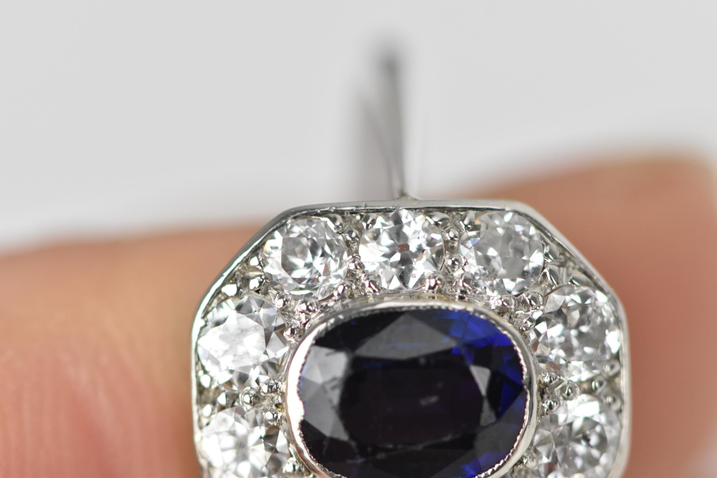 An Art Deco platinum, diamond and sapphire dress ring, the central deep blue sapphire in a - Image 5 of 6