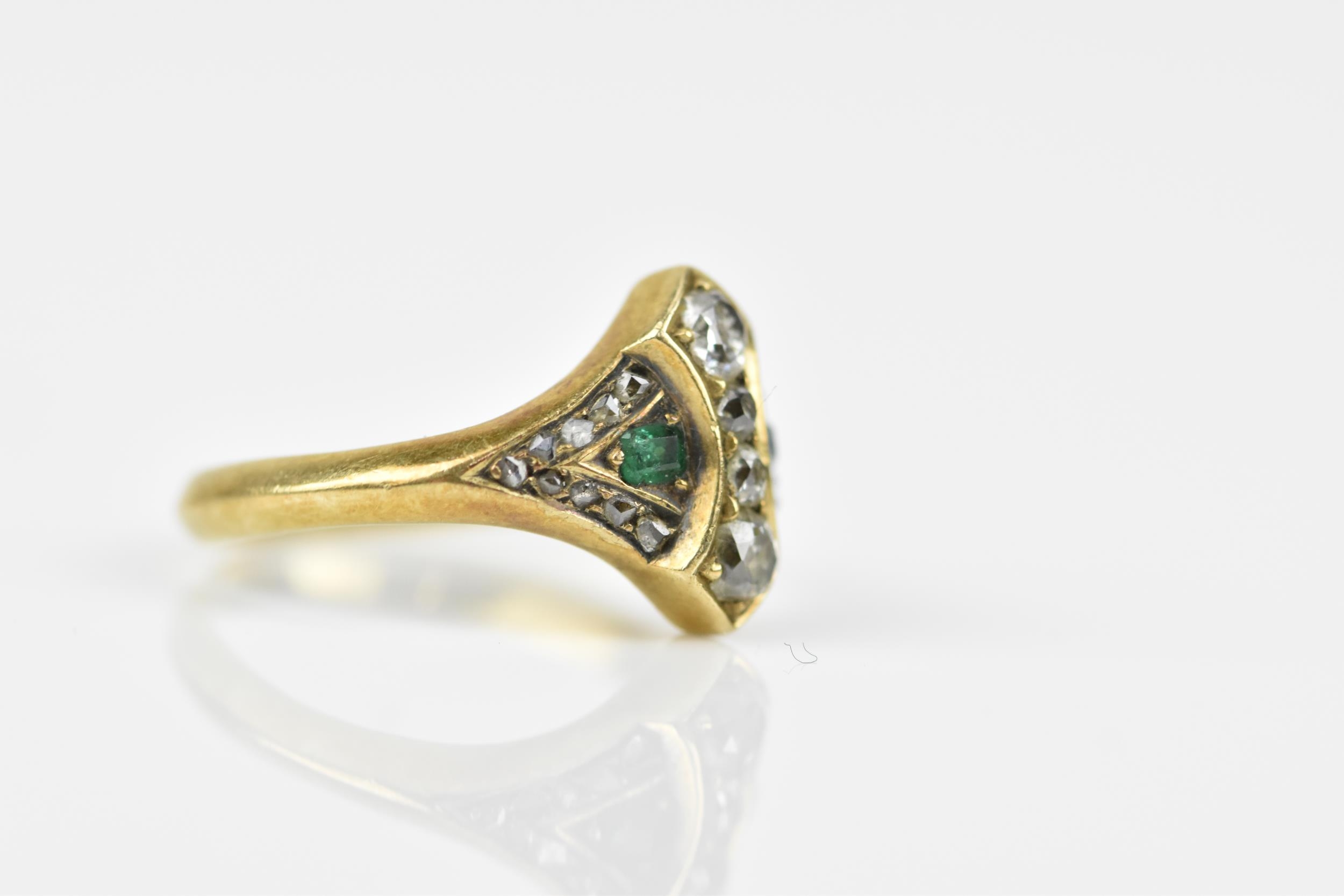 An early 20th century diamond and emerald dress ring, set with four graduated old mine cut - Image 3 of 5