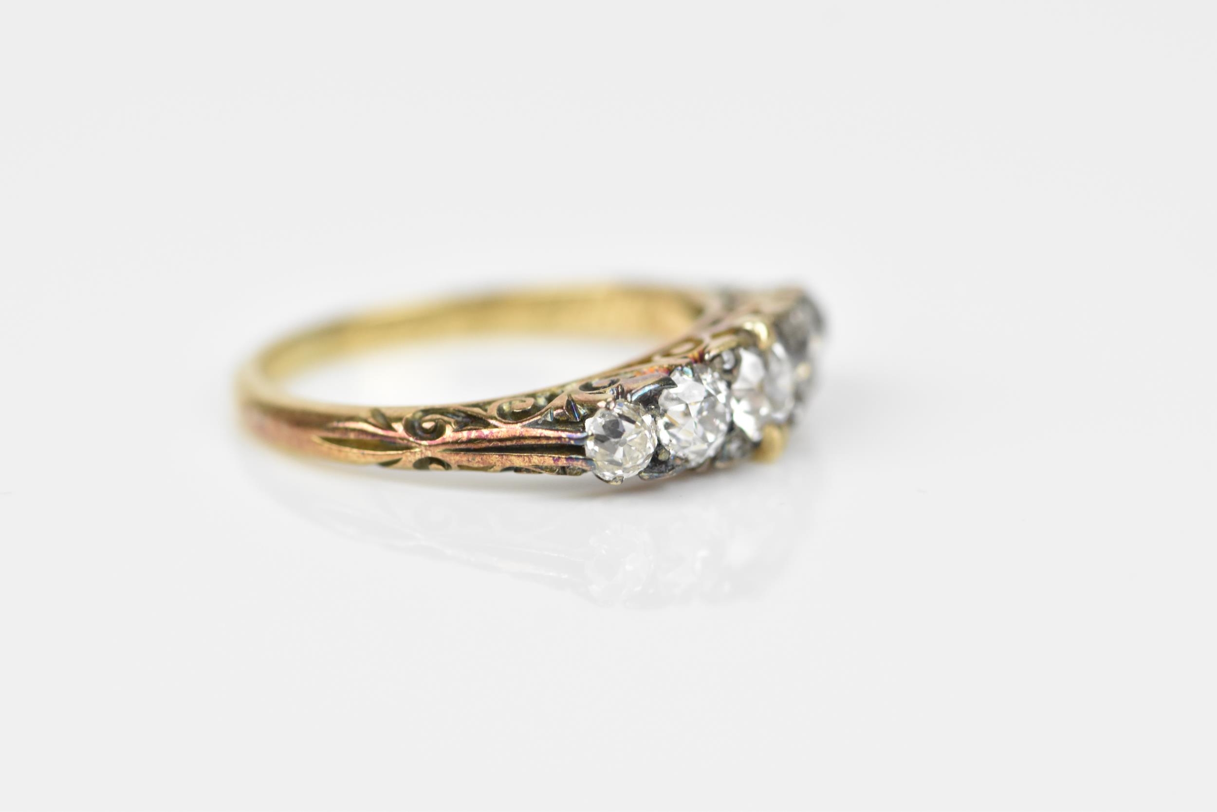 A yellow metal and five stone diamond ring, set with graduated old European cut stones, the - Image 3 of 6