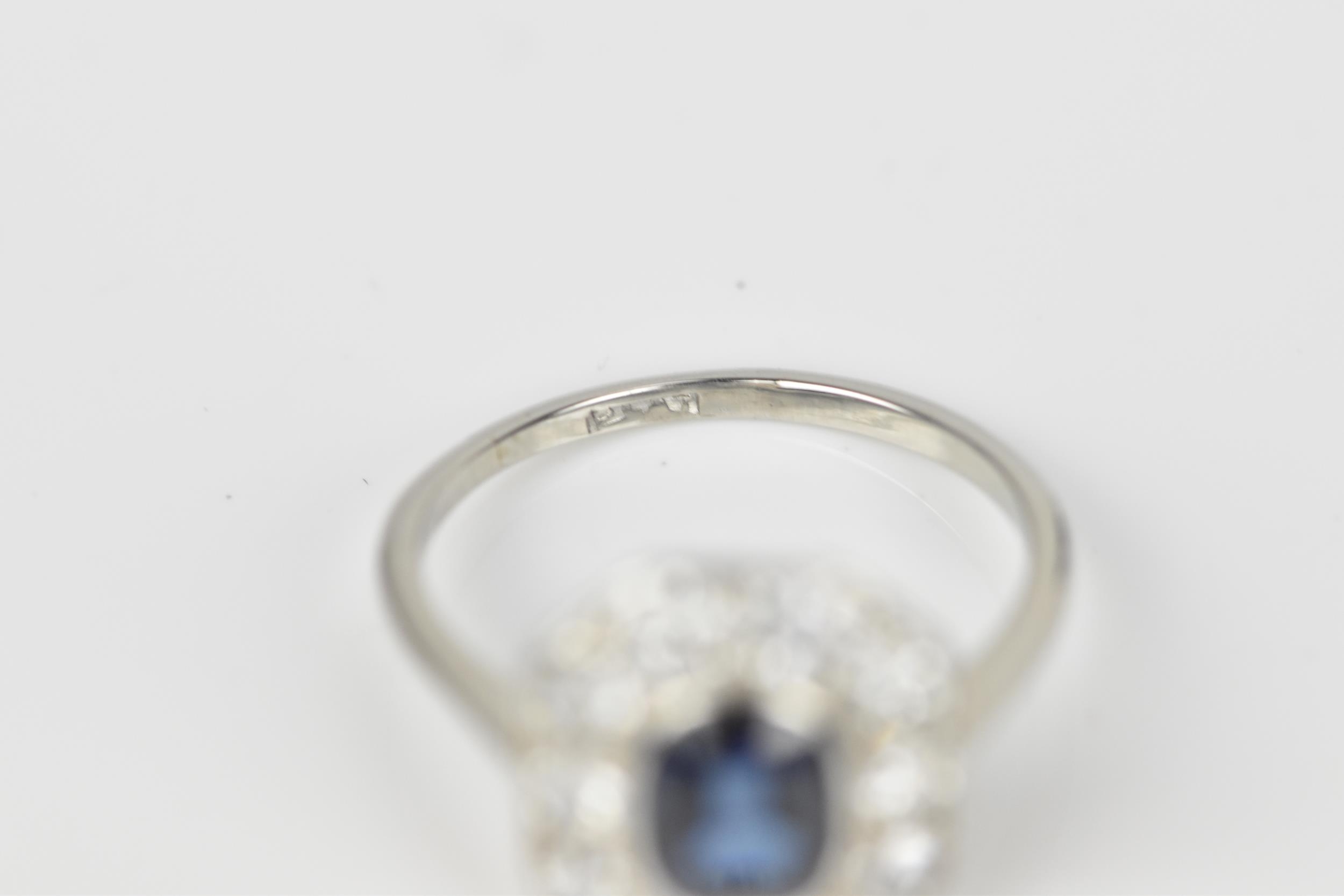 An Art Deco platinum, diamond and sapphire dress ring, the central deep blue sapphire in a - Image 4 of 6