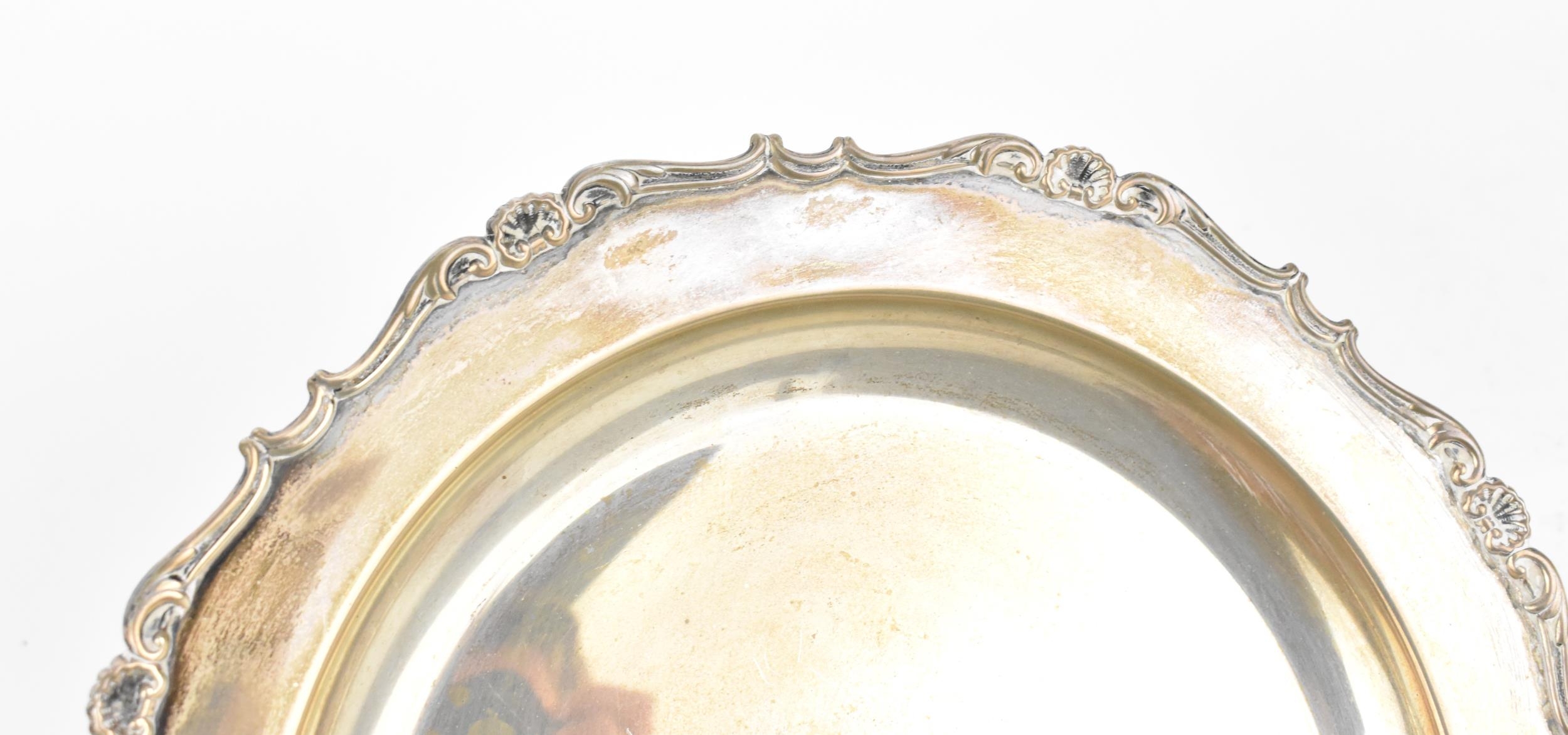 A Continental silver circular dish, probably Italian, with moulded shell border, stamped 800, 23.5 - Image 2 of 4