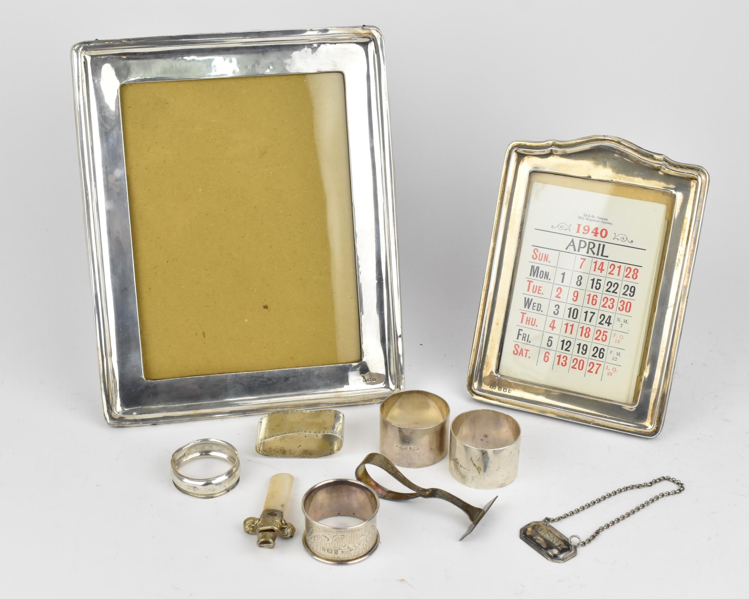 Two early 20th century silver framed photo frames, one by Henry Matthews, Birmingham 1922, the other