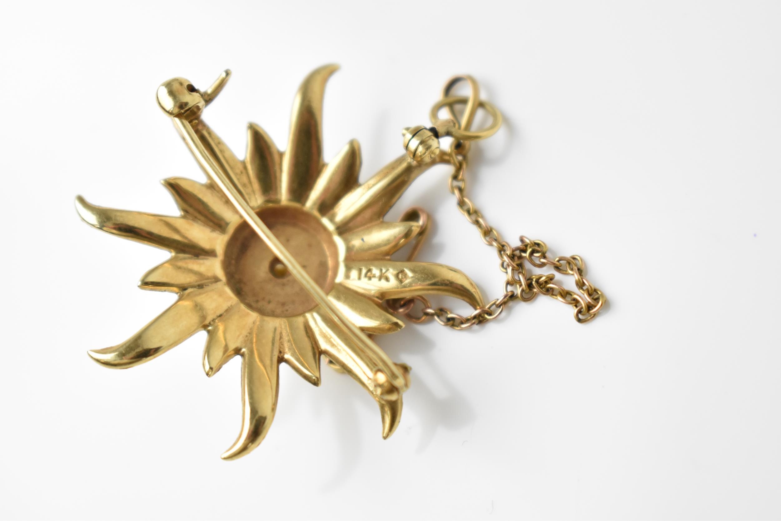 A 14ct yellow gold and seed pearl starburst brooch, inset with graduated seed pearls, stamped 14k, - Image 3 of 3