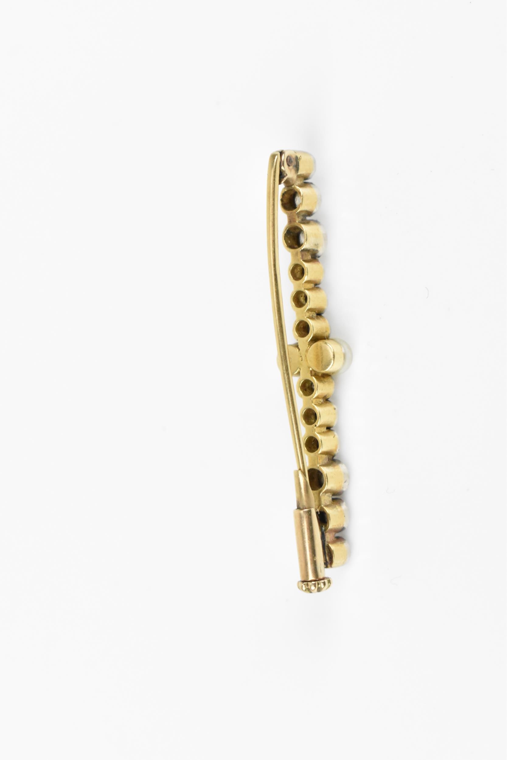 A yellow and white metal, diamond and pearl bar brooch, designed with twelve various sized rub- - Image 4 of 5