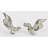 A pair of German partial gilt silver models of cockerels, the underside of the feet stamped '925