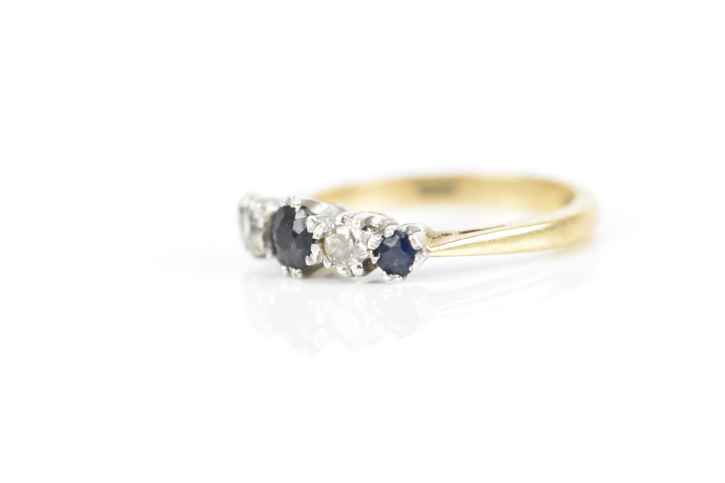 A 9ct yellow gold, diamond and blue sapphire five stone ring, designed with alternated and graduated - Image 2 of 5