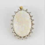 An 18ct yellow gold, white metal, diamond and white opal pendant/brooch, of oval design with central