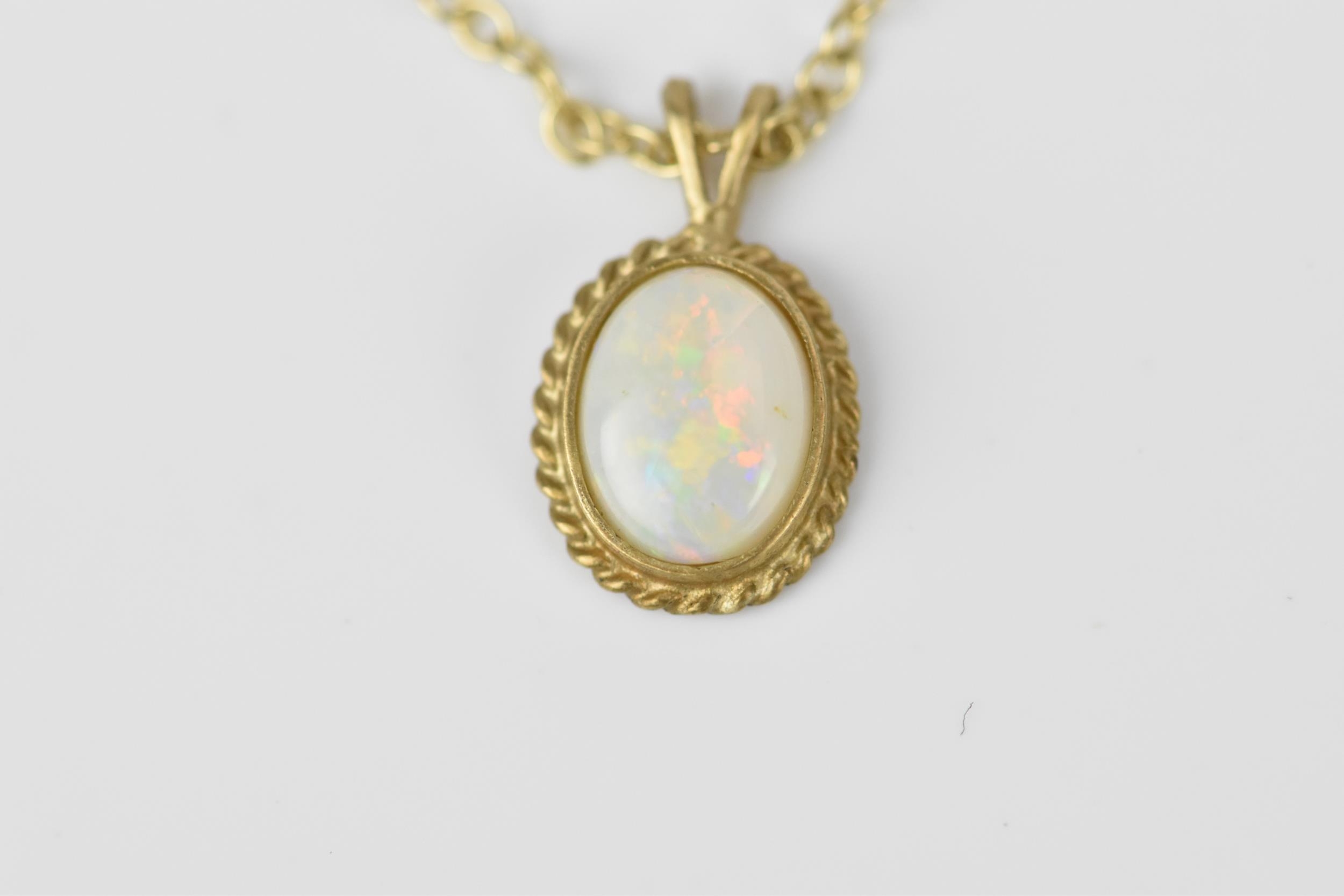 A 9ct yellow gold and opal necklace and earrings, with cable link, the cabochon white/red flash opal - Image 3 of 4