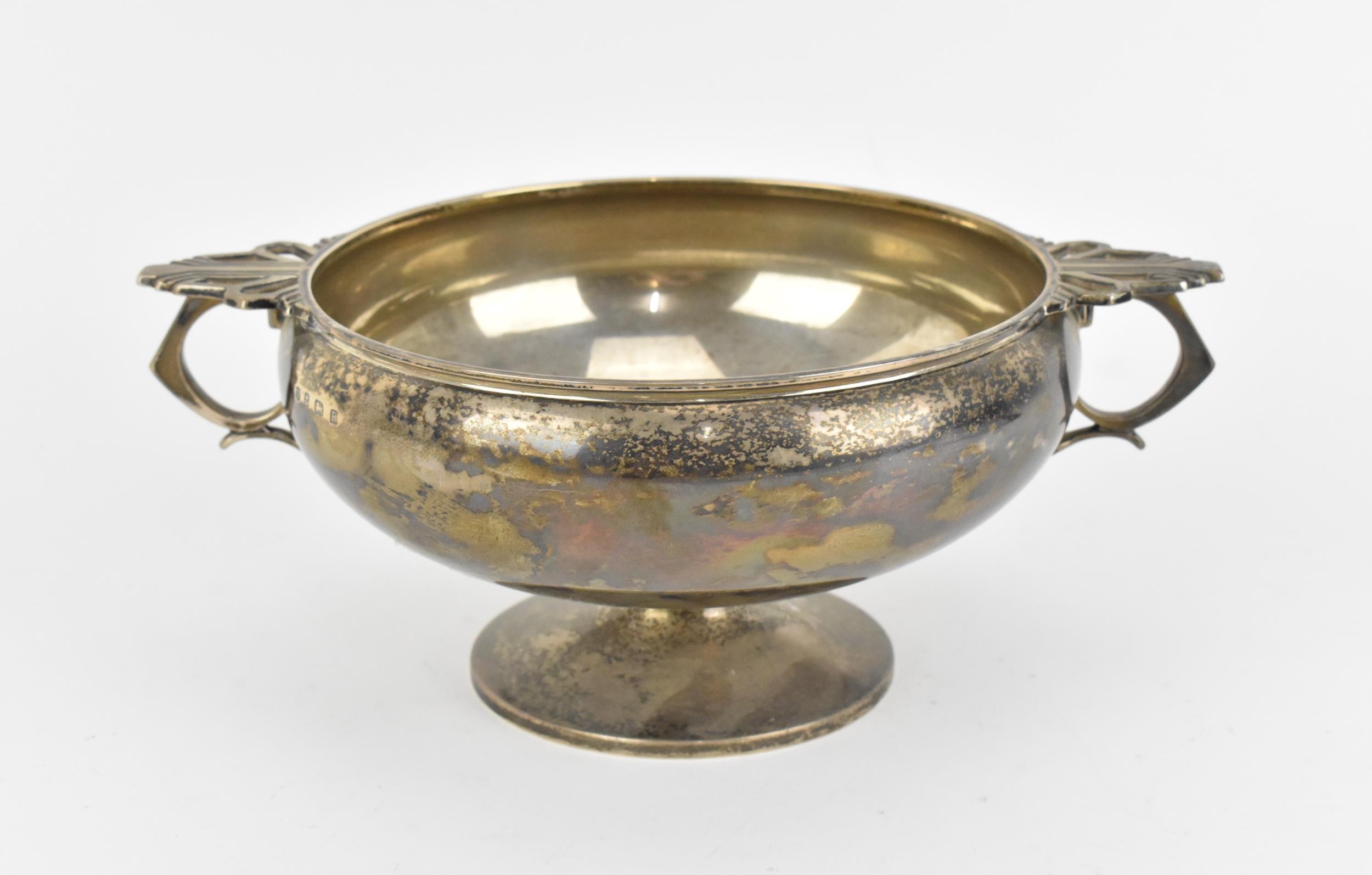 A George V silver footed bowl by William Neale & Son, Birmingham 1930, the bowl of circular form