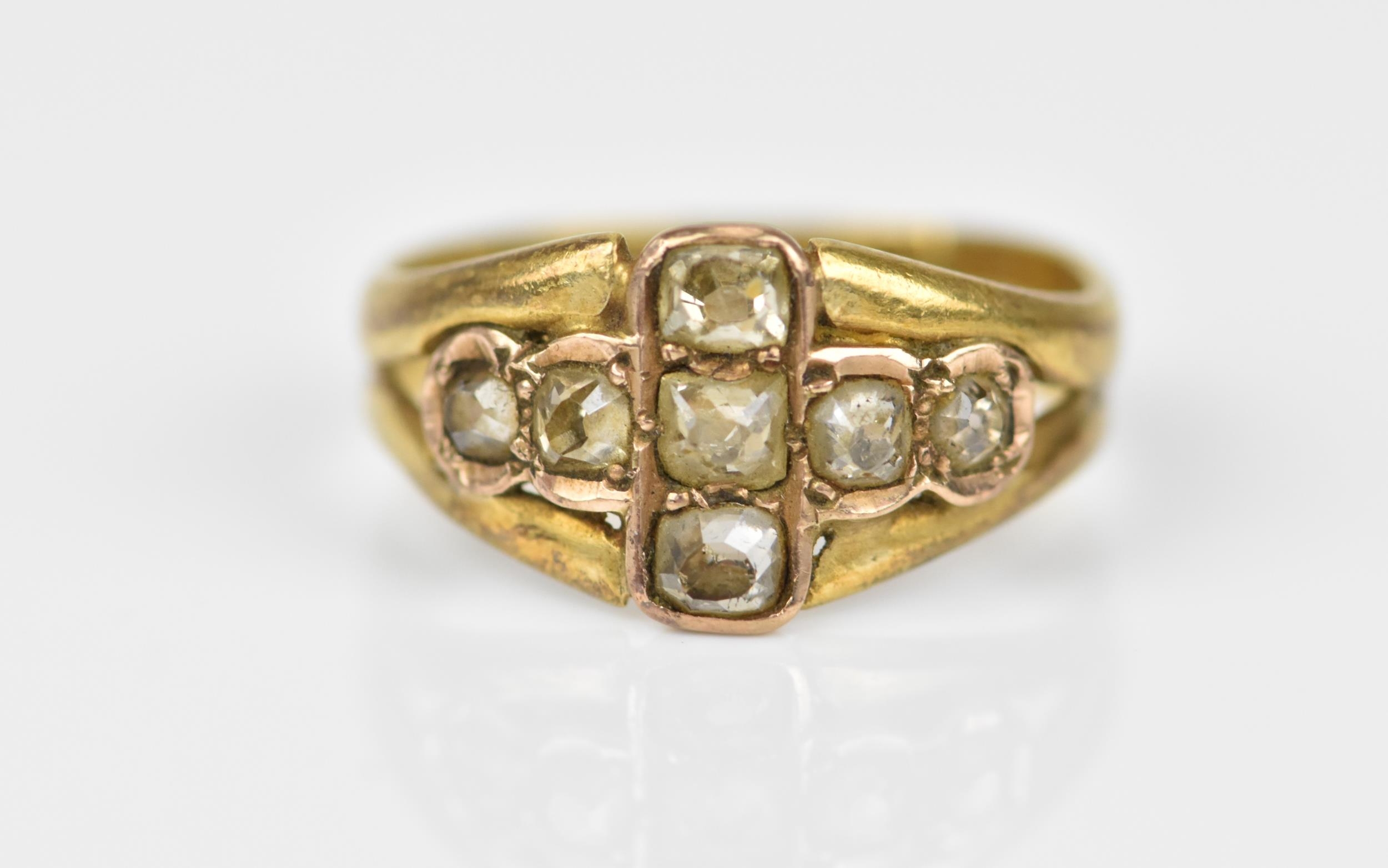 A Victorian yellow gold and diamond dress ring, set with seven rose cut diamonds forming a cross,