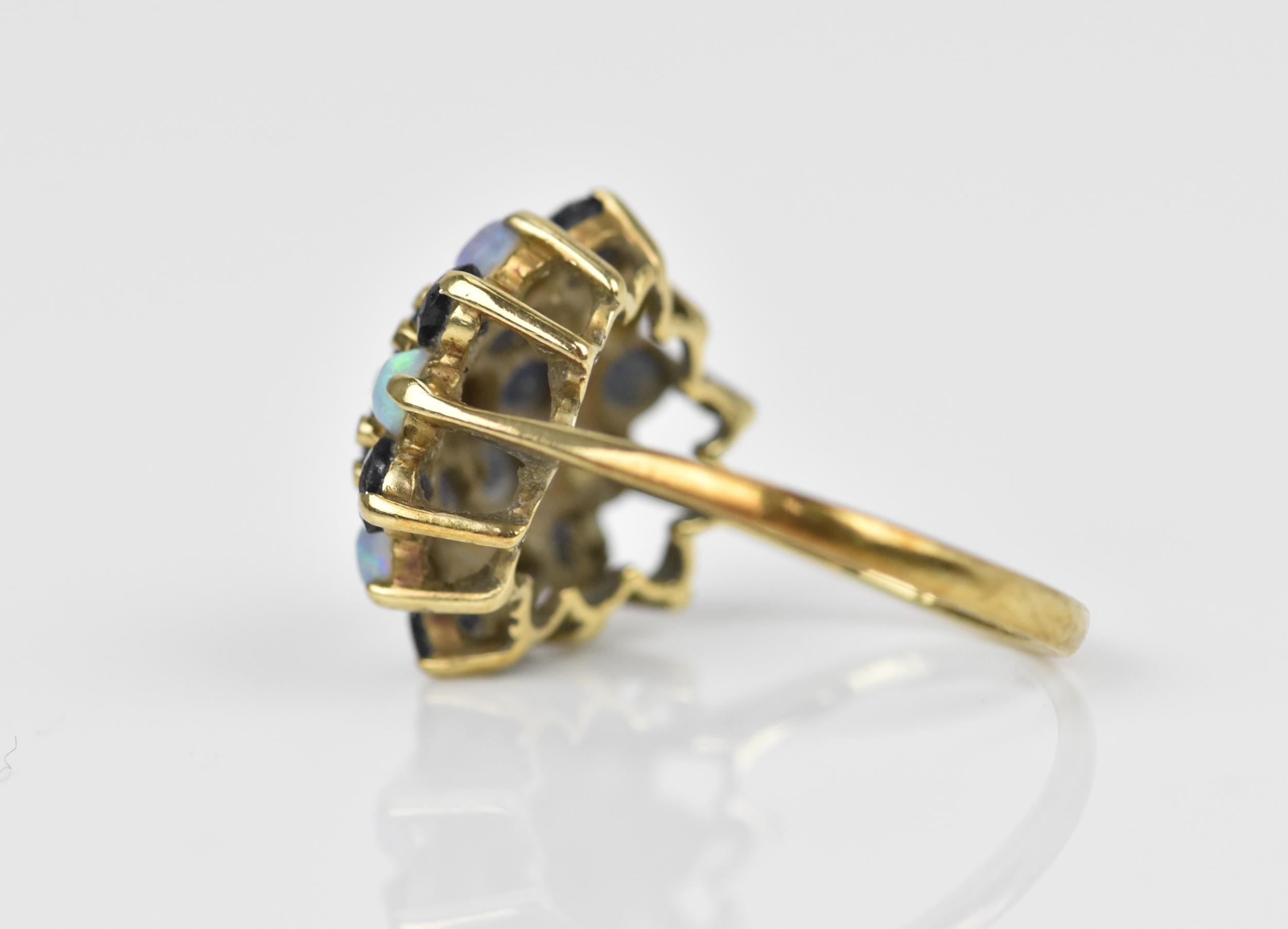 A yellow metal, blue sapphire and water opal dress ring, with cluster design of alternating cabochon - Image 2 of 4