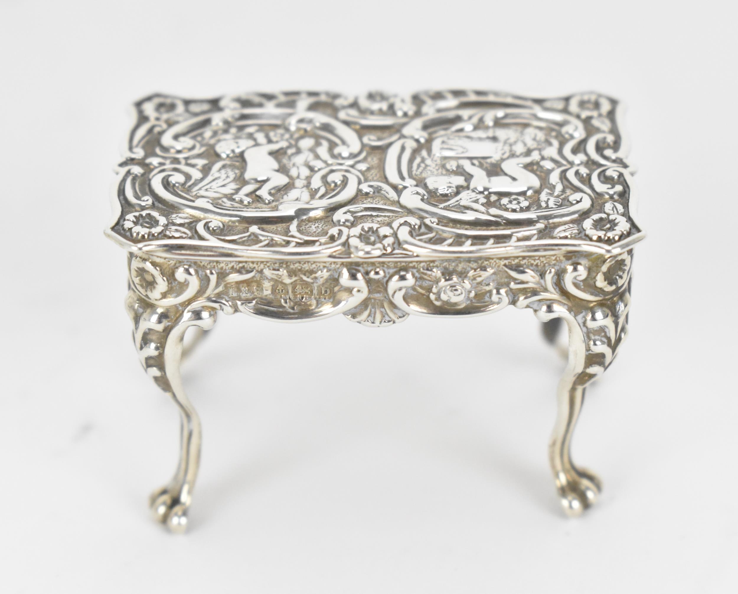 A small collection of silver and white metal miniature doll house furniture, to include a silver - Image 4 of 8