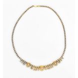 An Edwardian gold plated and seed pearl fringe necklace, designed with three spaced shells divided