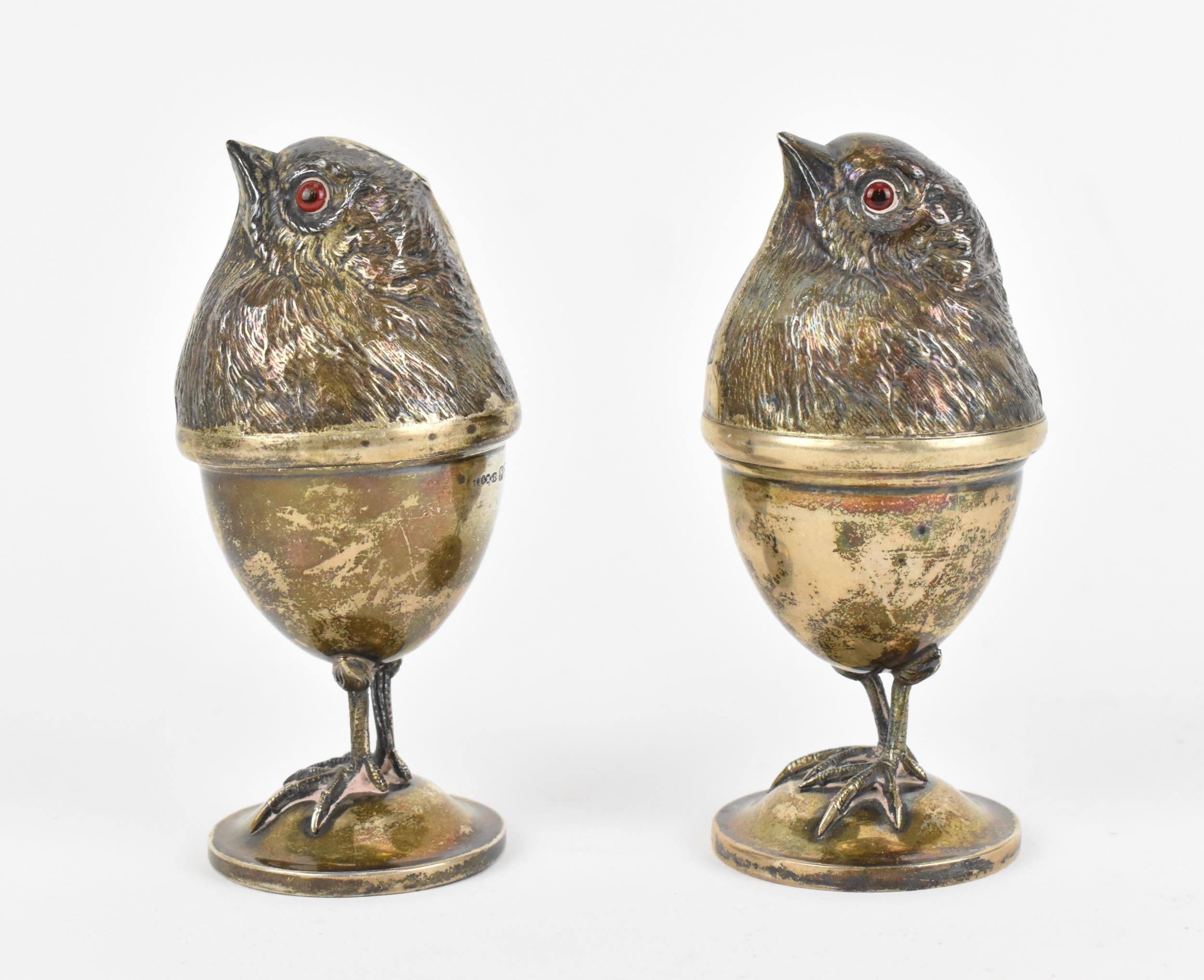 Two Edwardian silver novelty egg cups by Sampson Mordan & Co Ltd, Chester 1909, modelled as