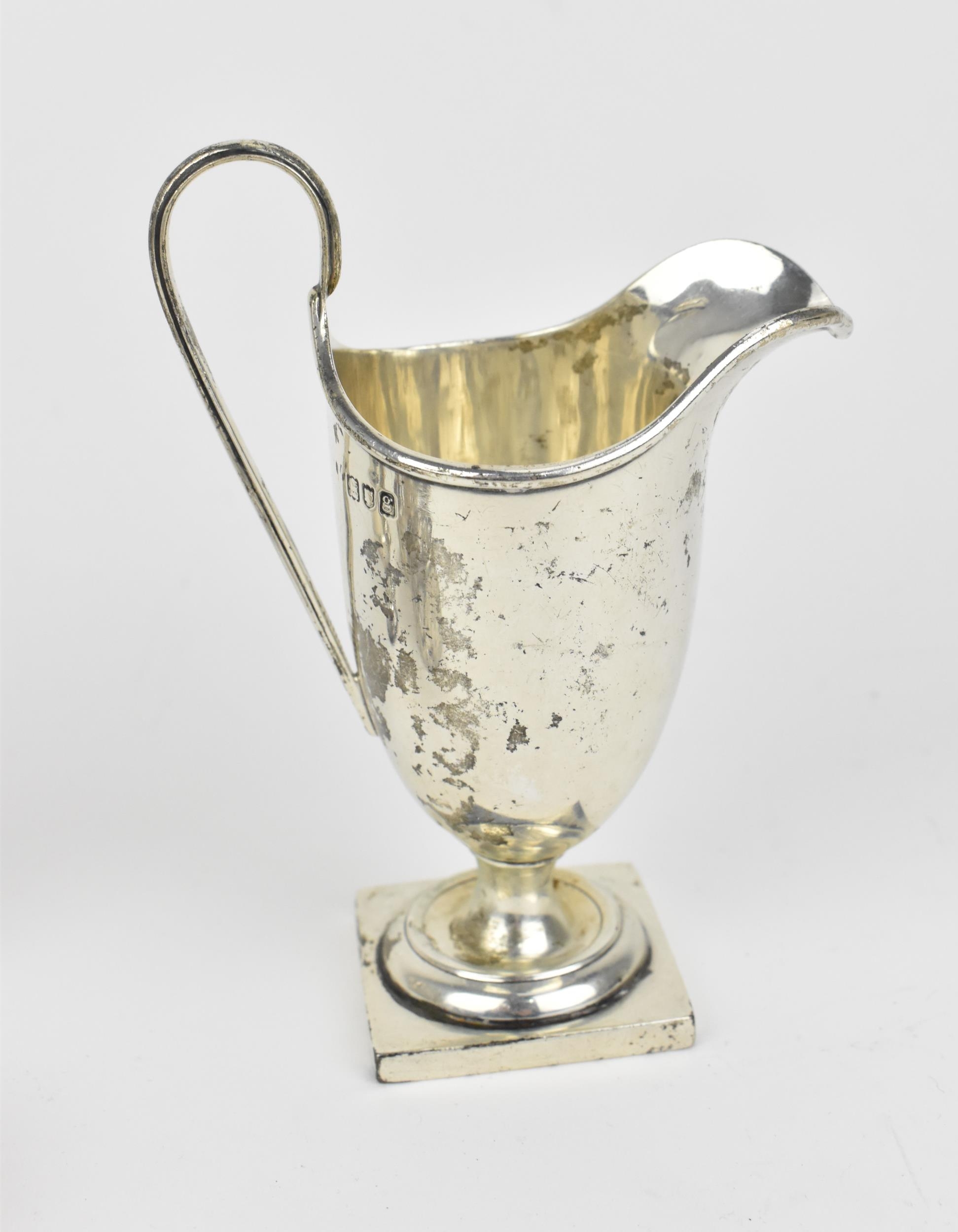 A small collection of silver, to include an Edwardian silver milk jug, a pair of Victorian pepper - Image 2 of 9