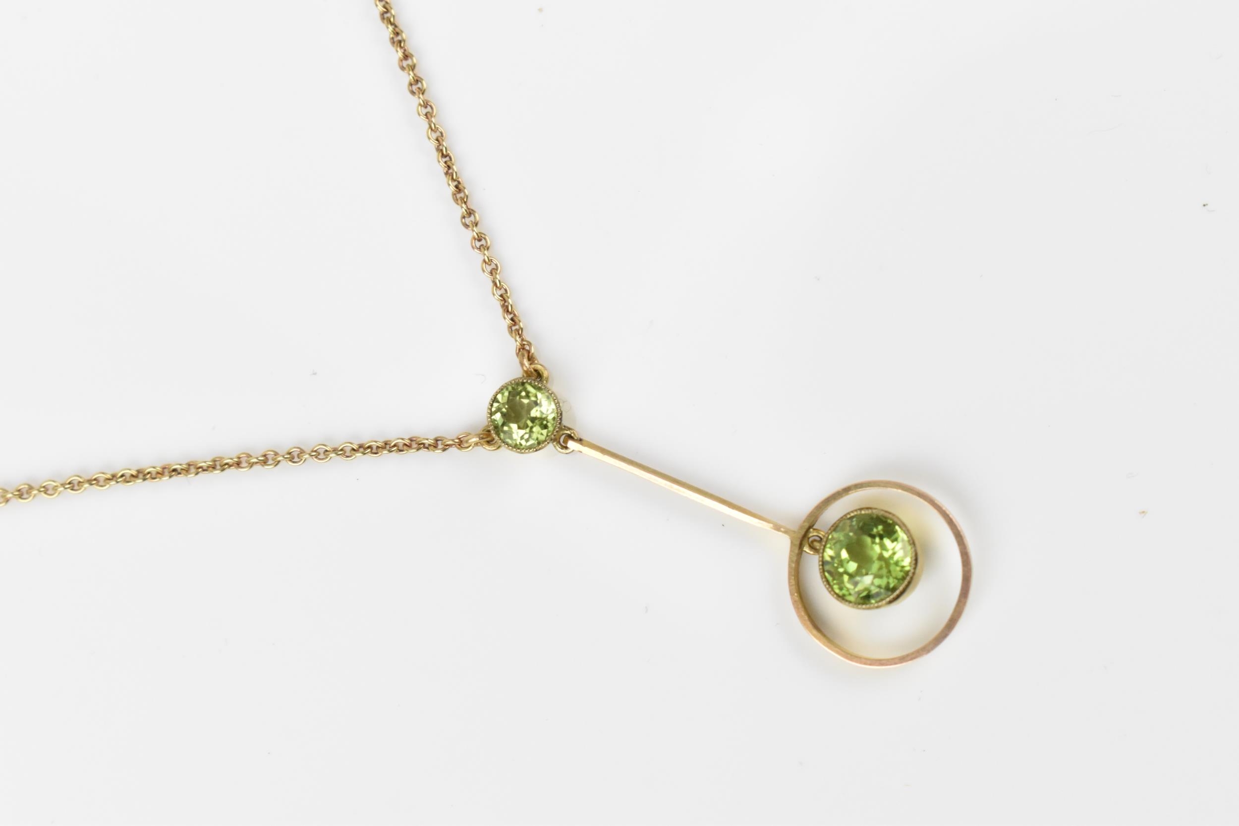 An early 20th century 9ct yellow gold and peridot necklace, the cable link chain with central - Image 2 of 3