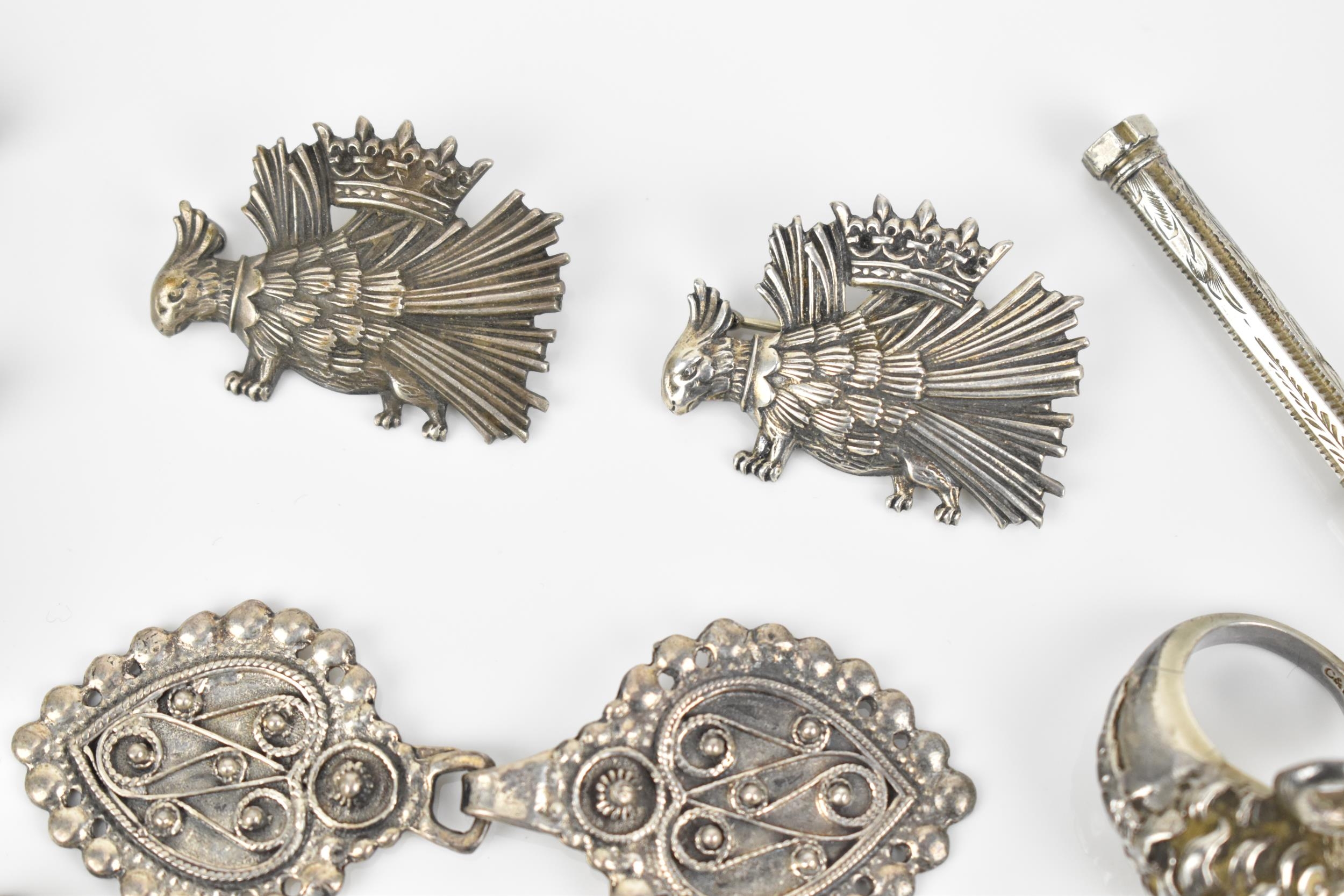 A small collection of metal brooches, to include a silver model of a fish, three white metal crown - Image 3 of 6