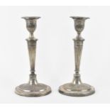 A pair of late Victorian silver candlesticks by Fordham & Faulkner, Sheffield 1898, in the Adam