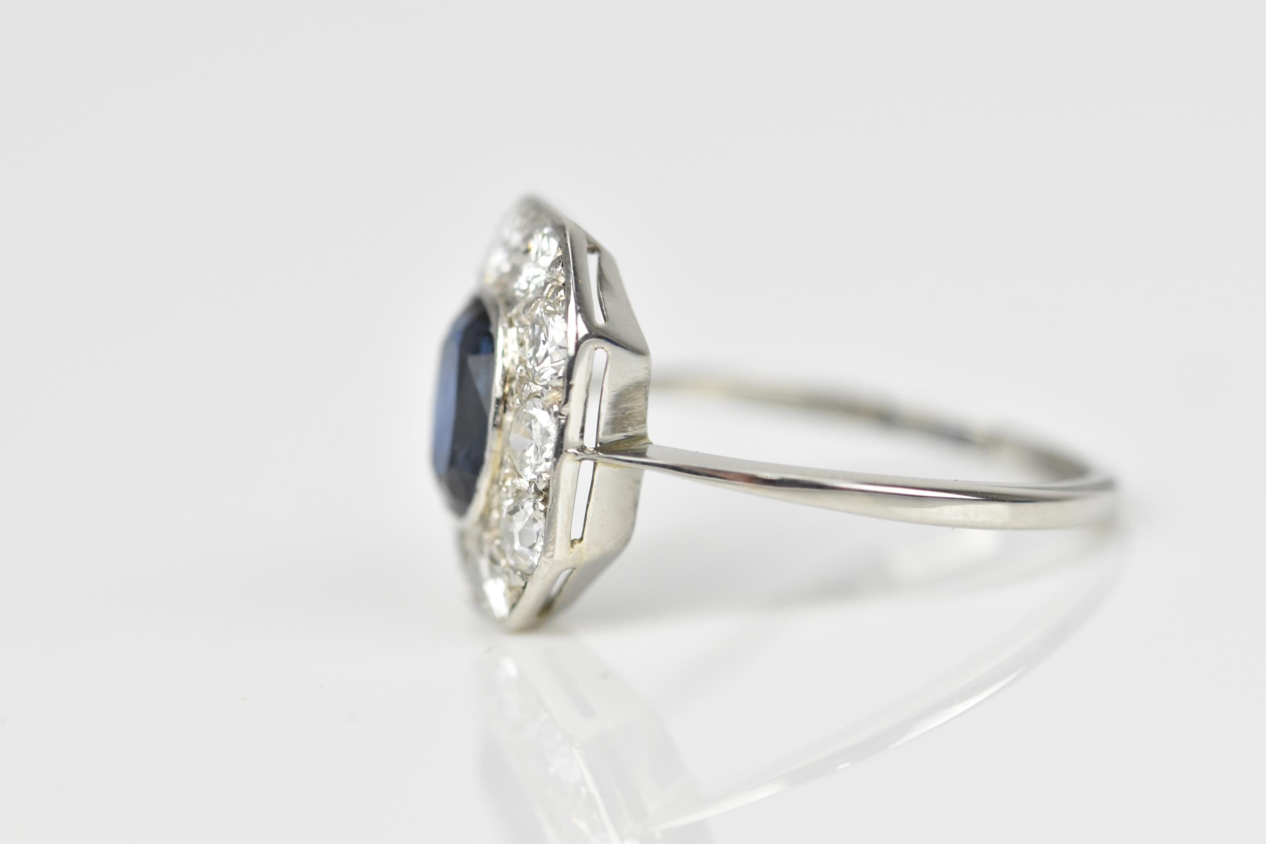 An Art Deco platinum, diamond and sapphire dress ring, the central deep blue sapphire in a - Image 2 of 6