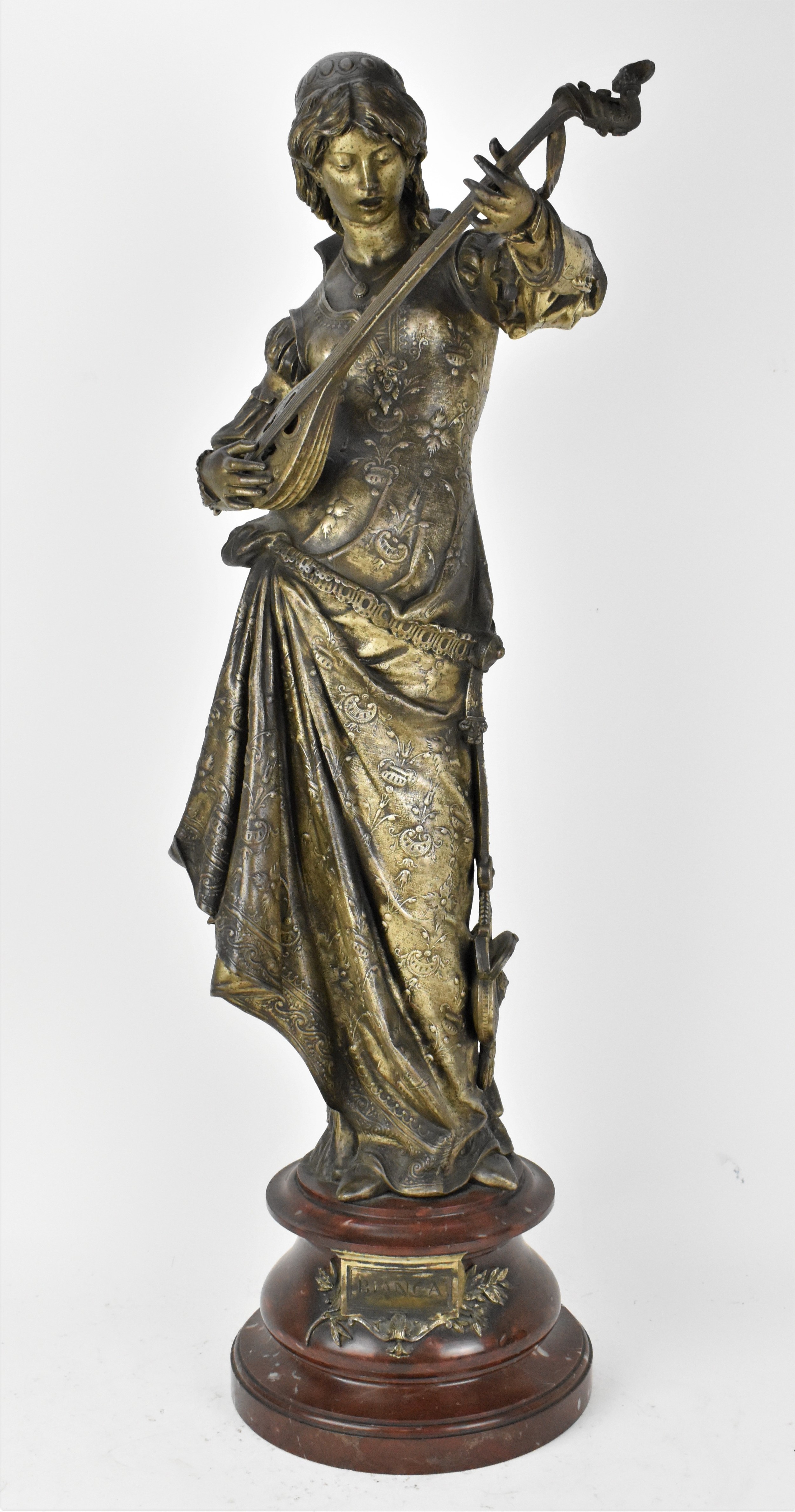 A late 19th century spelter Orientalist sculpture, titled 'Bianca', modelled as a female mandolin