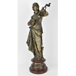 A late 19th century spelter Orientalist sculpture, titled 'Bianca', modelled as a female mandolin