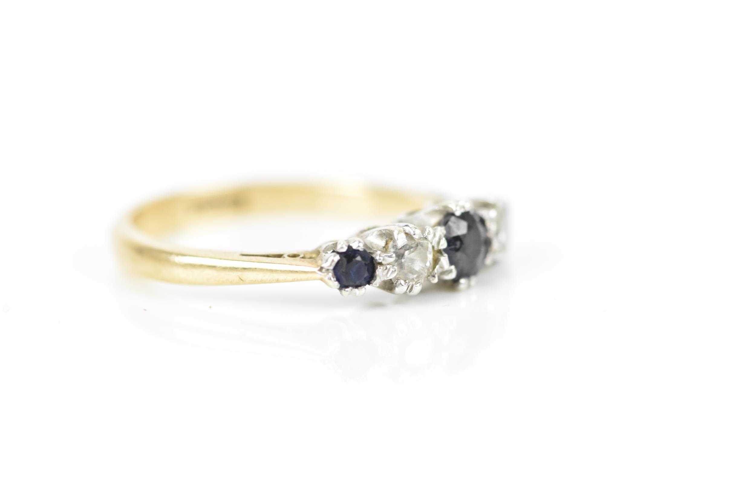 A 9ct yellow gold, diamond and blue sapphire five stone ring, designed with alternated and graduated - Image 5 of 5