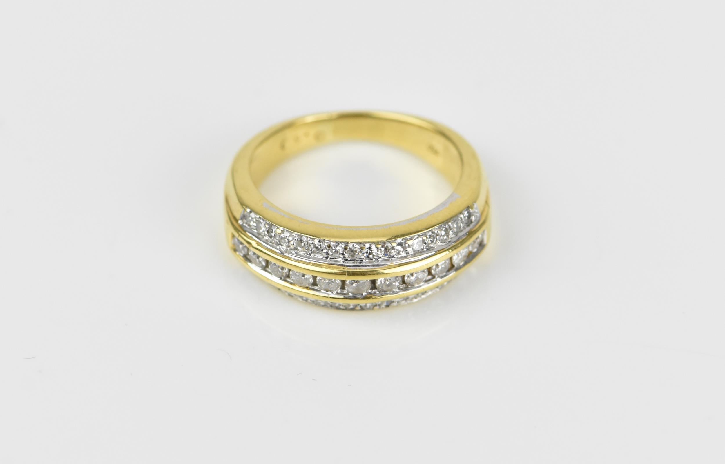 An 18ct yellow gold and diamond three row ring, set with a central row of brilliant cut channel - Image 2 of 5