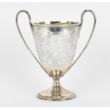 A George III silver and silver-gilt trophy cup by Henry Chawner, London 1796, with elongated