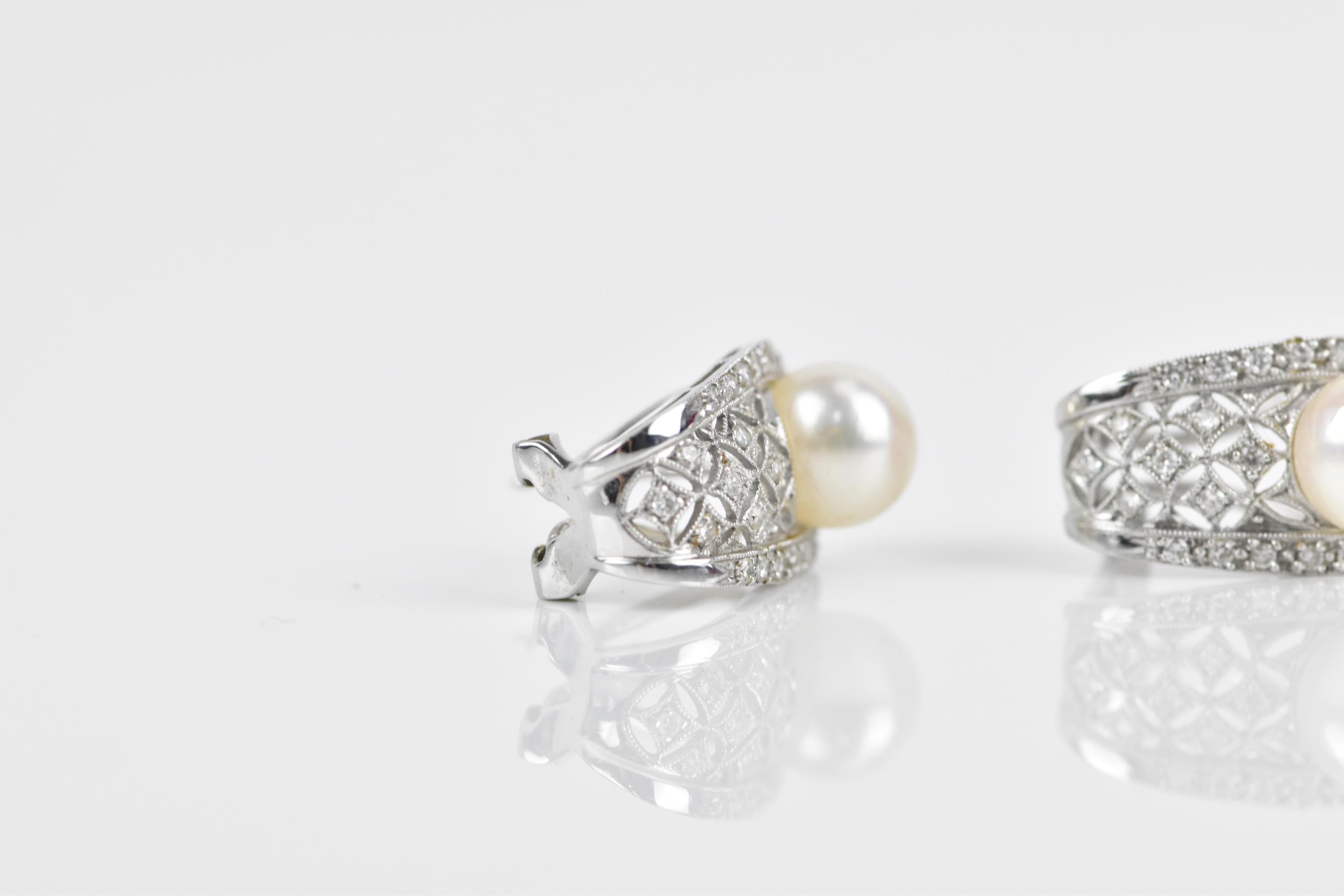A pair of 18ct white gold, diamond and pearl earrings, of pierced lattice design, each inset with - Image 3 of 5