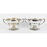 A pair of George V silver twin-handled presentation footed bowls, one by W & F Rabone (Walter