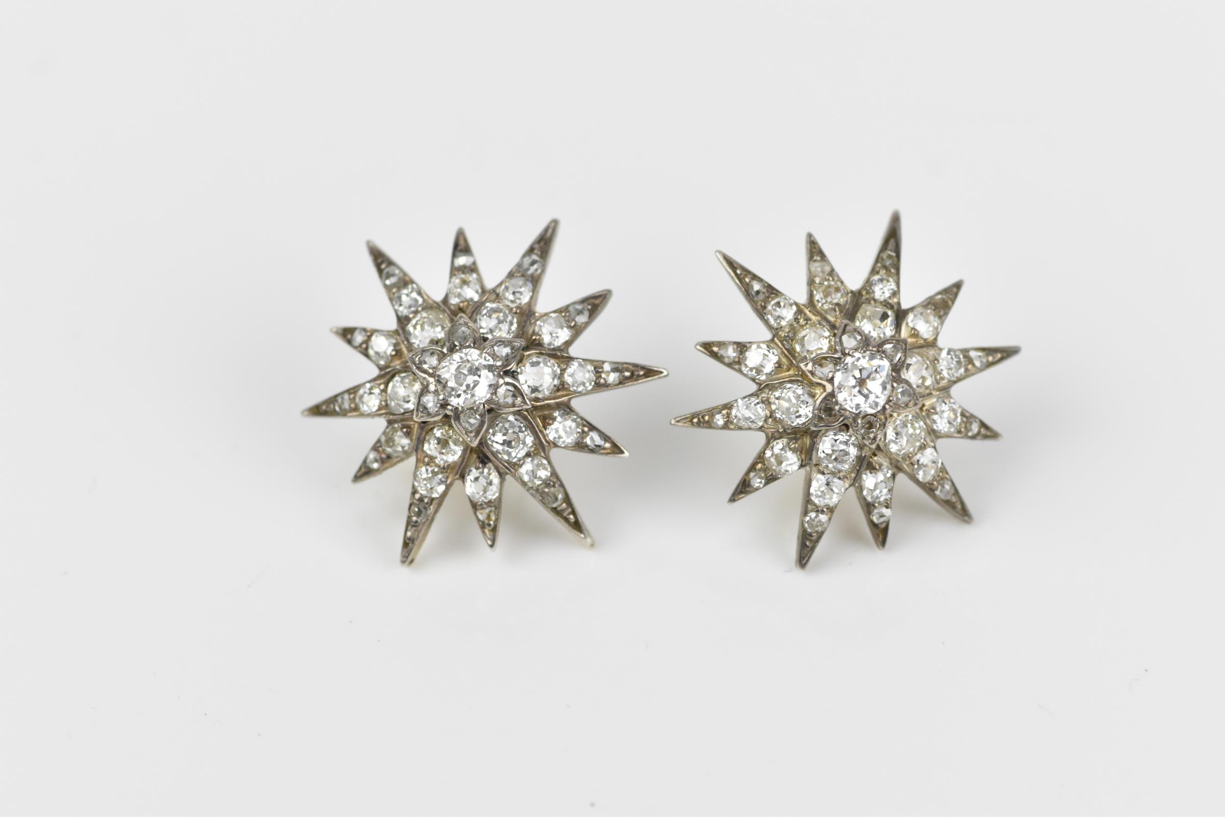 A pair of early 20th century white metal and diamond starburst earrings, set with old mine cut - Image 2 of 9