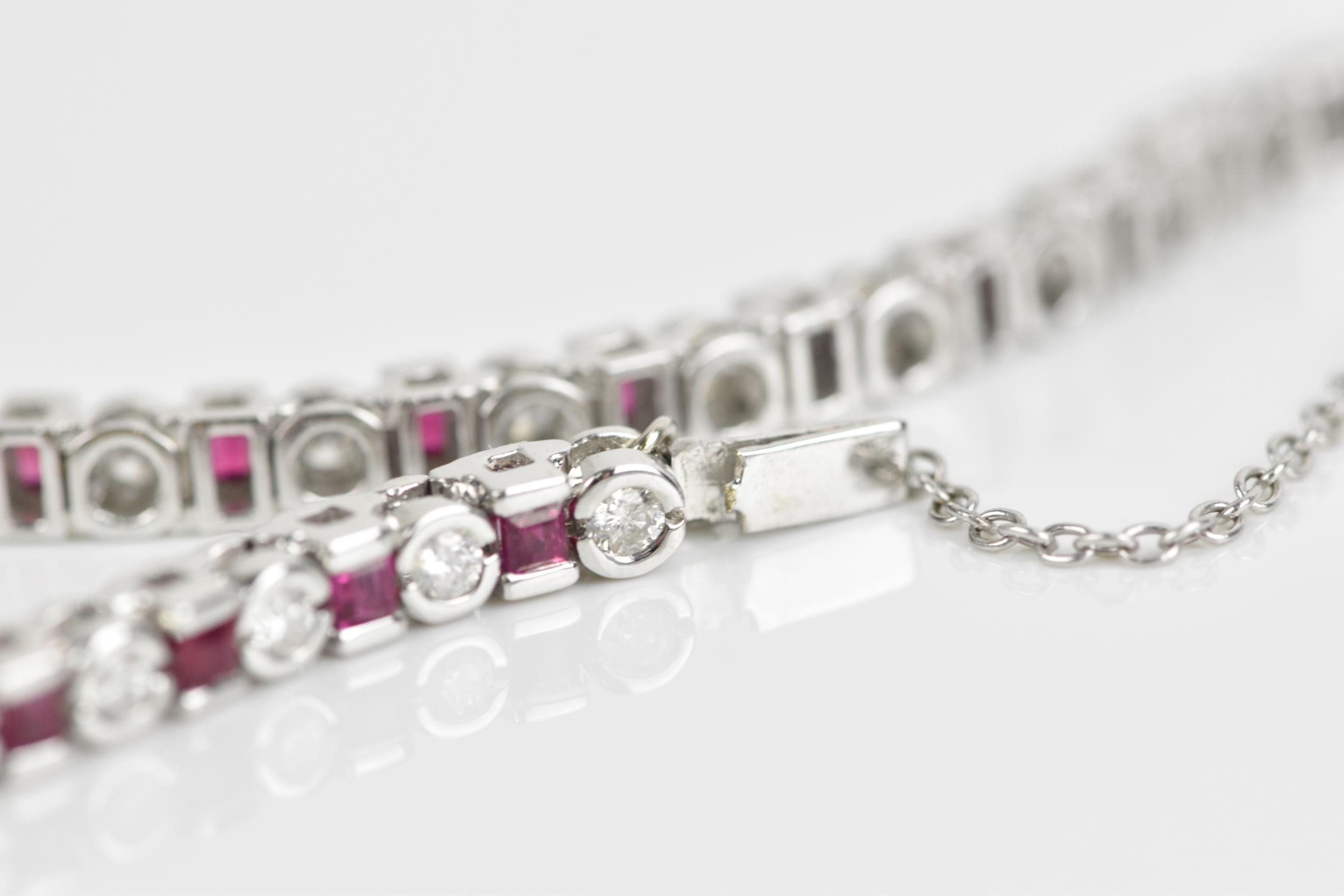 An 18ct white gold, diamond and ruby bracelet, with alternating round brilliant cut diamond and - Image 6 of 8