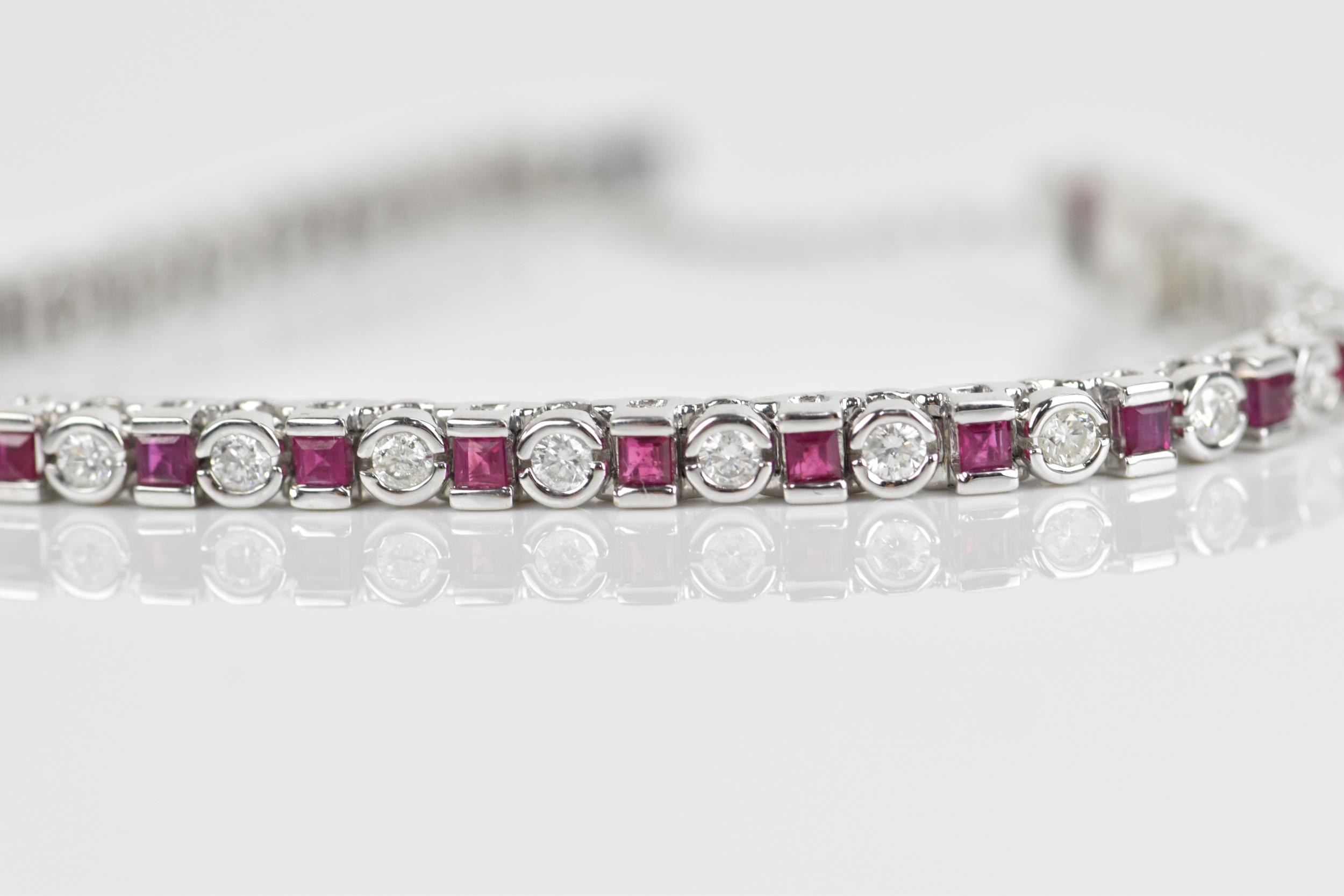 An 18ct white gold, diamond and ruby bracelet, with alternating round brilliant cut diamond and - Image 3 of 8
