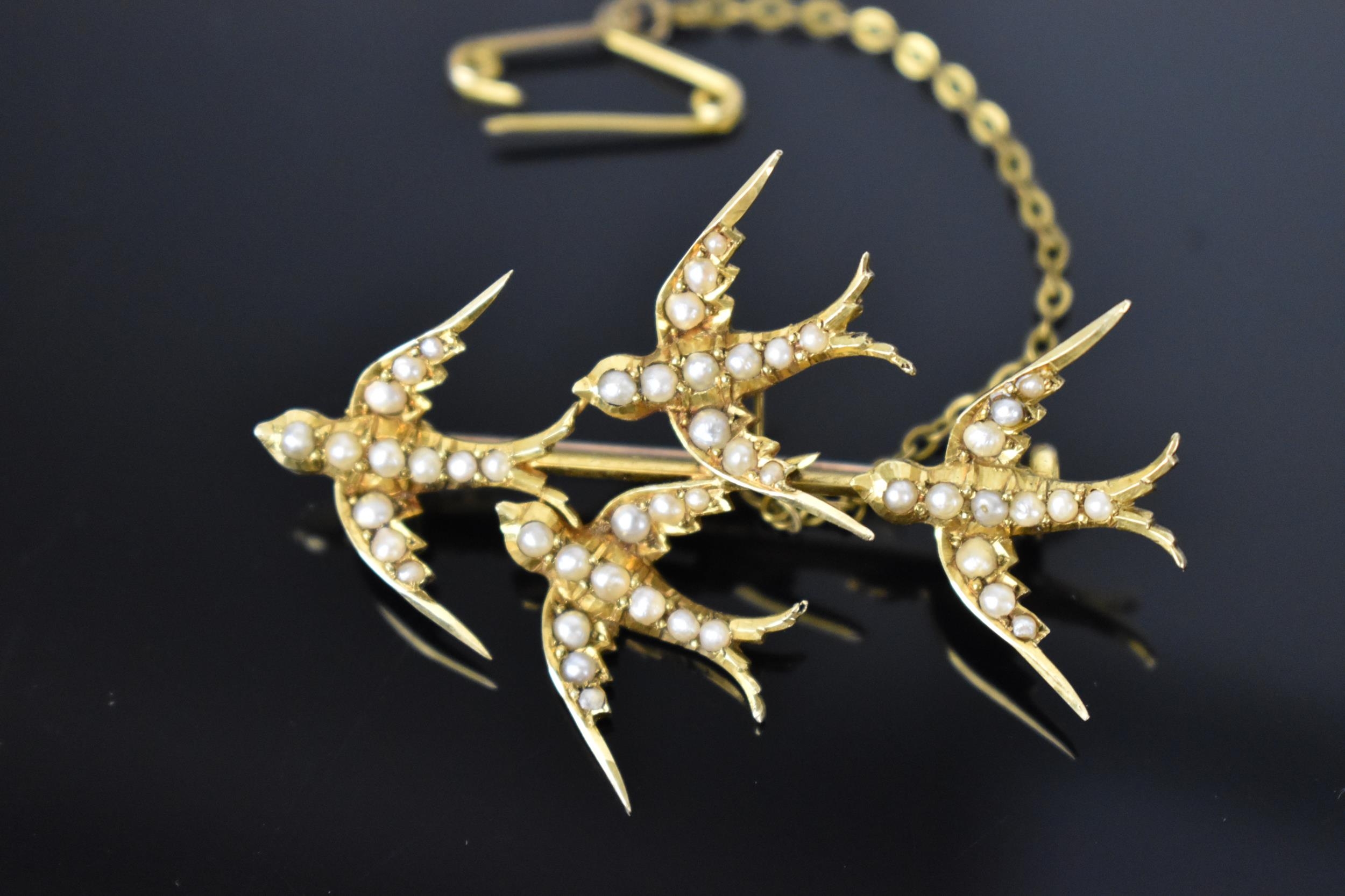 A 15ct yellow gold and seed pearl swallow brooch, probably Victorian, marked 15ct, with safety chain - Image 2 of 6