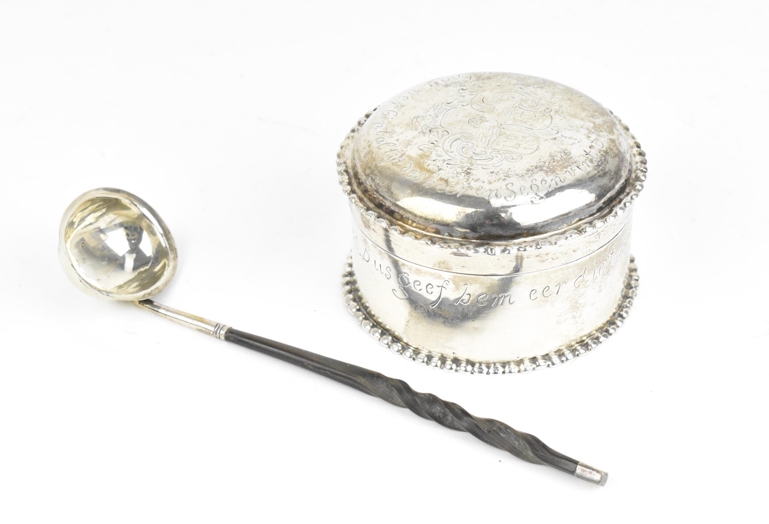 A George III silver toddy ladle, London 1814, with twisted whalebone handle, together with a