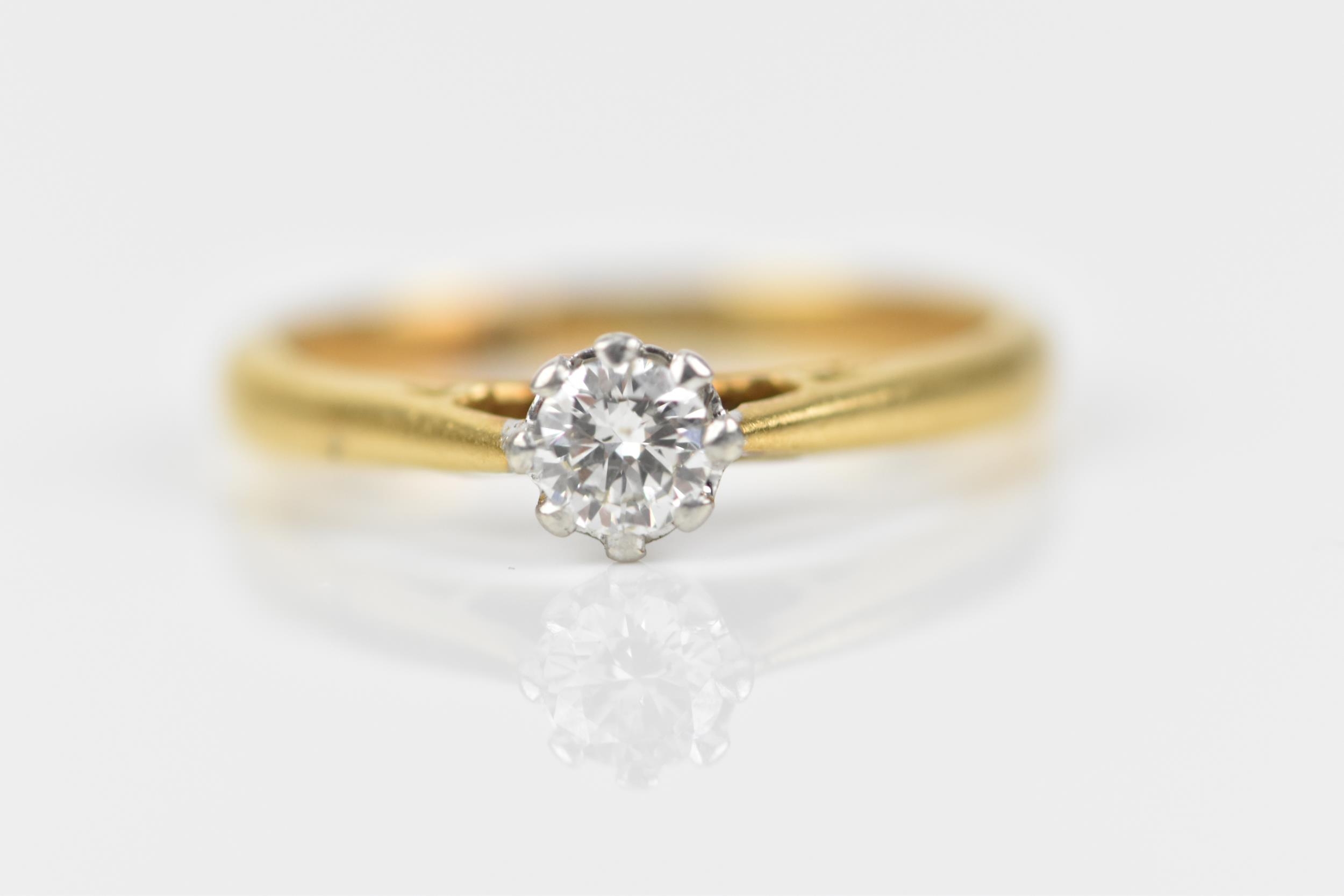 An 18ct yellow gold, platinum and diamond solitaire ring, the brilliant cut stone set in an eight - Image 5 of 6