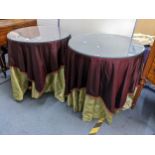 A pair of purpose made circular tables having double layered table cloths comprising a lime silk