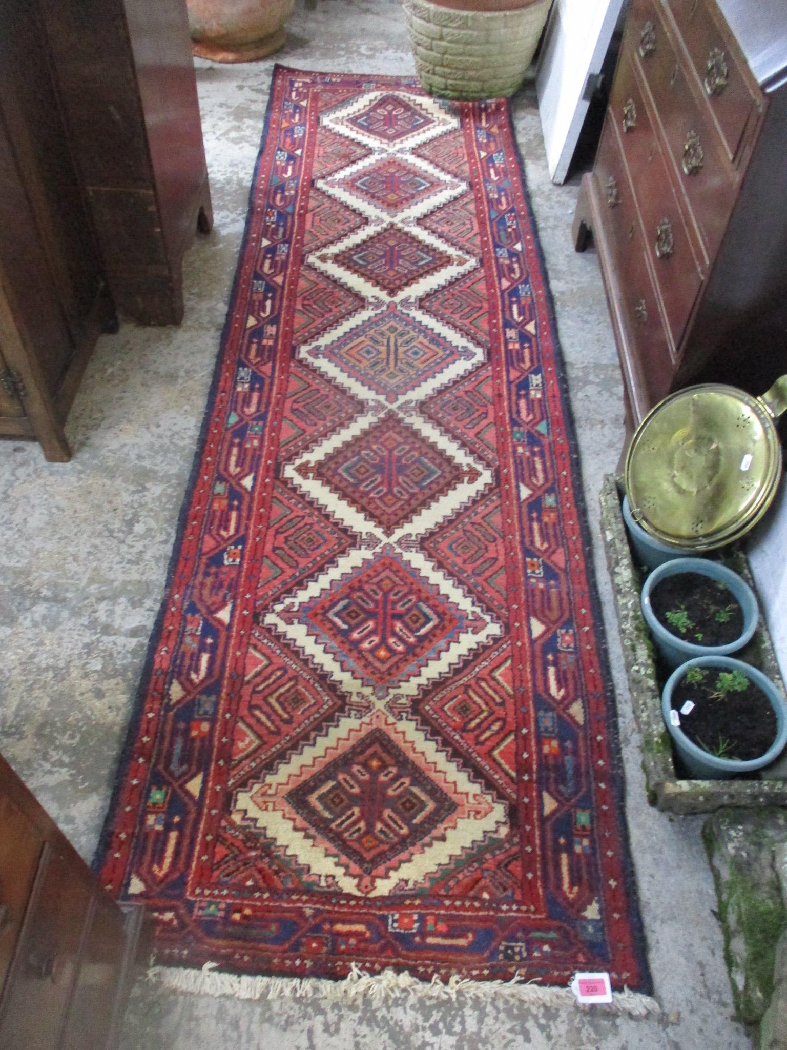 An Iranian Hamadon style runner, hand woven with diamond motif, 287cm x 80cm Location: