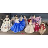 A collection of 12 figures of ladies, mostly Royal Doulton examples, to include Isadora, Diana,