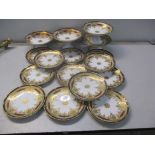 A Noritake part dinner service having heavy gilded decoration on a white ground Location: