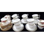 A set of ten Royal Doulton Isabella bone china tea cups and saucers, a quantity of Royal Albert