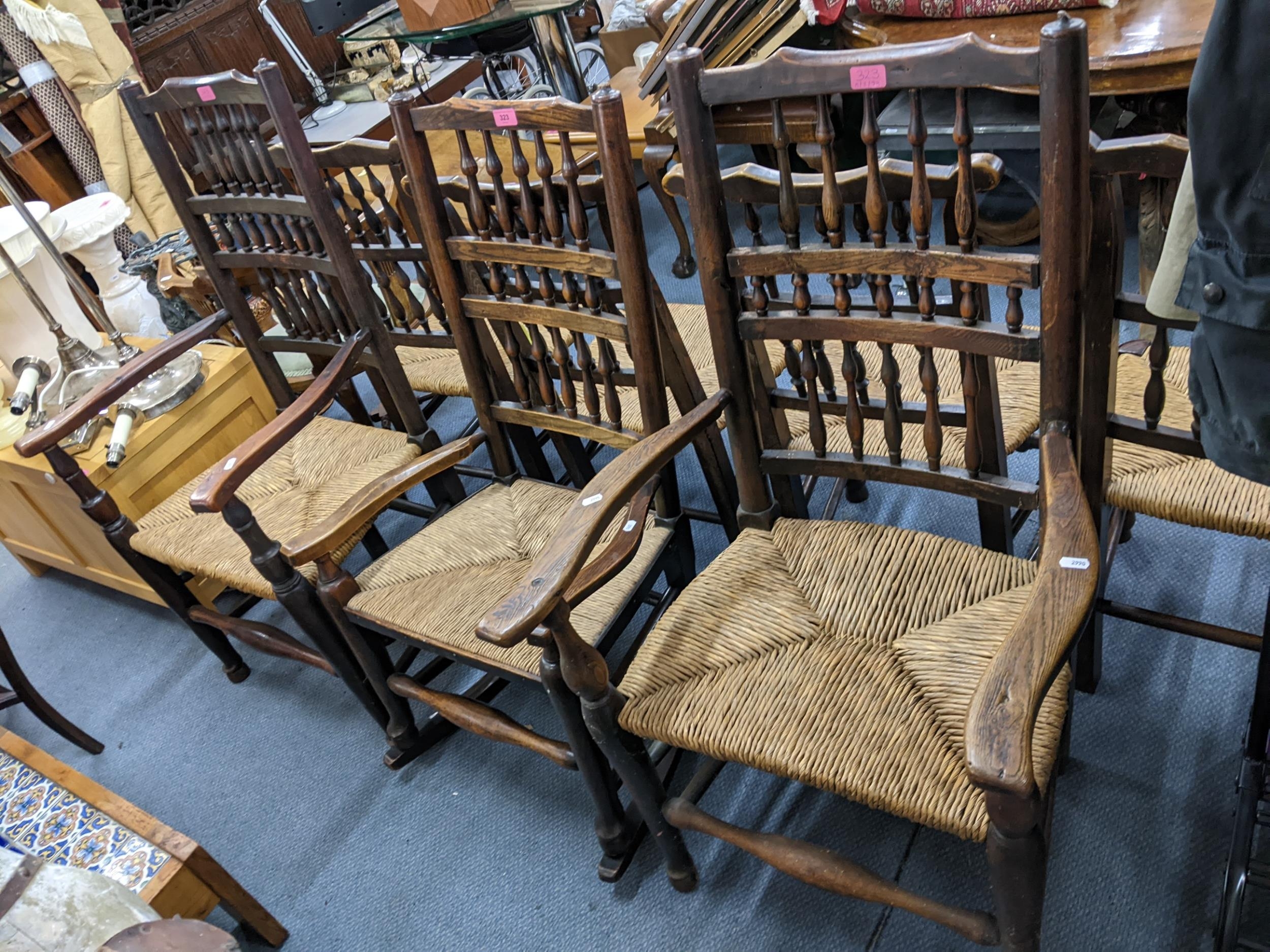 A pair of 19th century country ash wood rush seated armchairs, together with a similar rocking chair