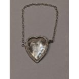 A silver heart shaped decanter label for Brandy or Bourbon, inscribed B by Levi and Salaman,