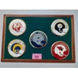 Five enamelled American NFL discs mounted and framed Location: