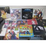 A collection of classical, easy listening, musicals, and pop LPs and singles to include Elvis a