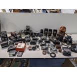 A collection of vintage folding box Instamatic and other film cameras to include a Polaroid Sun