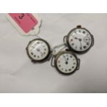 Three early 20th century silver cased watches to include a trench watch having Roman numerals and