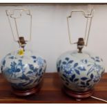 A pair of blue and white Oriental vases on red wooden stands, 20cm high Location: G