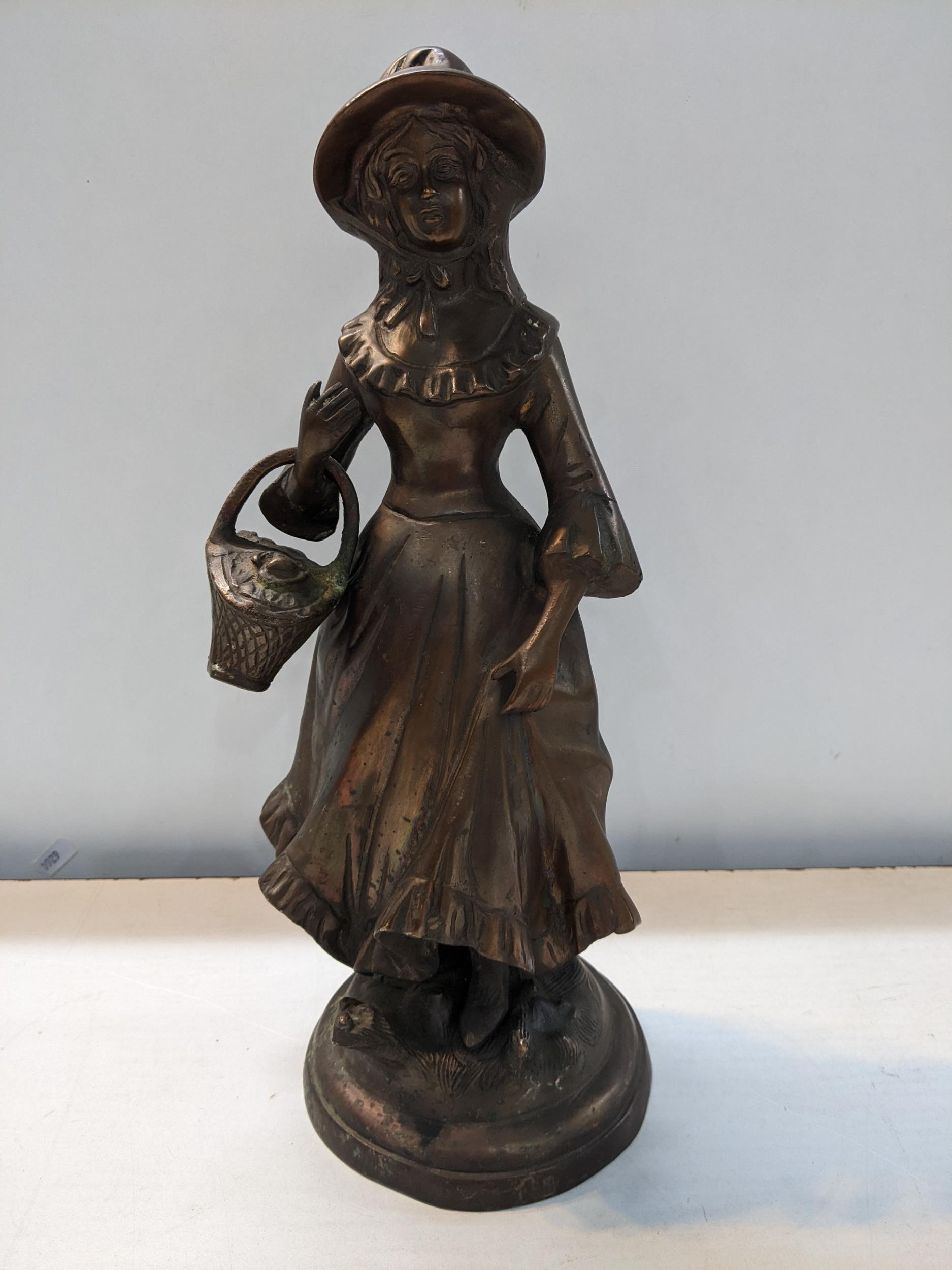 A 20th century cast bronze figure of a girl carrying a basket, 34.5cm h Location: 10:1