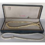 A single strand cultured pearl necklace with a 14ct gold clasp, together with a pearl necklace